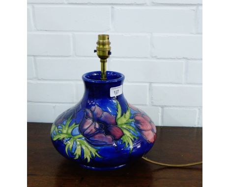 A Moorcroft table lamp, the blue ground tube line decorated with Anemones 