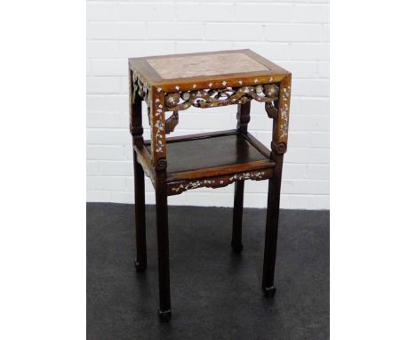 A Chinese hardwood and mother of pearl inlaid side table, the rectangular top with an inset red marbled panel, over an undert