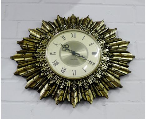 A sunburst style wall clock, 36 x 45cm