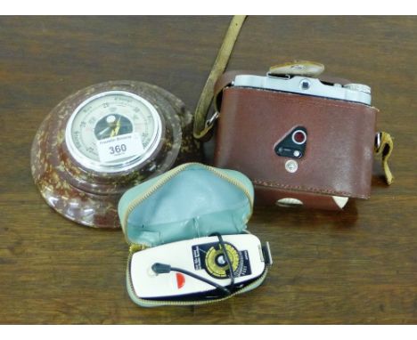 A circular hardstone mounted wall barometer, together with a vintage Solida I camera, (a lot) 