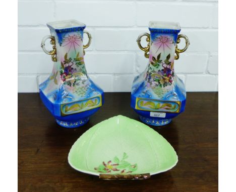 A pair of continental porcelain twin handled vases, together with a Carlton ware moulded leaf dish, tallest 26cm, (3) 