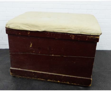 A large storage trunk with padded seat to top