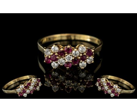 18ct Gold Attractive Diamond &amp; Ruby Set Dress Ring, marked 750 to interior of shank.  The rubies and diamonds of good col