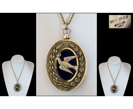 1930's Large and Impressive Silver and Silver Gilt - Ornate Oval Shaped Locket, Which Features a Silver Flying Bird on a Blue