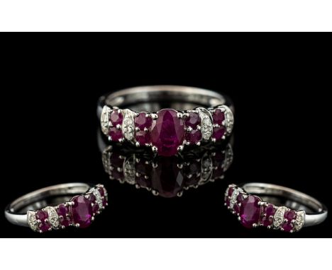 Ladies 9ct White Gold - Attractive Ruby and Diamond Set Ring. Full Hallmark for 9.375. The Diamonds and Rubies of Good Colour