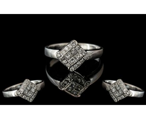 18ct White Gold - Attractive and Well Designed Diamond Set Dress Ring. Marked 750 - 18ct to Shank. The Princes Cut and Brilli