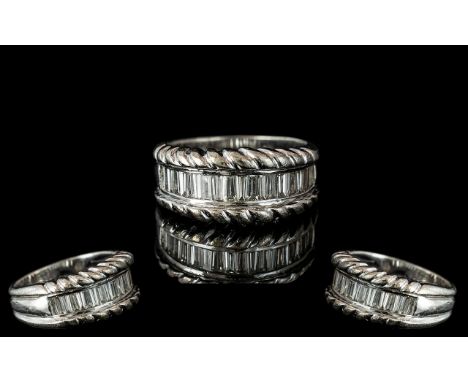 18ct White Gold - Attractive Diamond Set Half Eternity Ring. Marked 750 -18ct. The Step-cut Diamonds of Excellent Colour and 