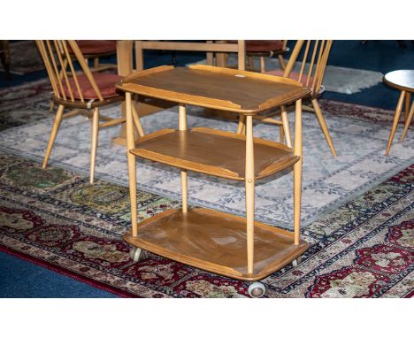 An Ercol Blonde Beech/Elm Three Tier Trolley 28 x 18 inches, height 31 inches. Raised on Casters. 