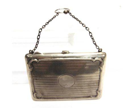 A SILVER EVENING PURSE by Deakin & Deakin, Chester 1911, with engine turned decoration, silk interior with aide memoire, stam