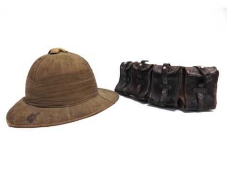 MILITARIA - A GREAT WAR BRITISH ARMY WOLSELEY PITH HELMET  of typical pattern, the inner inscribed with a list of place names