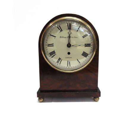 A FIGURED MAHOGANY MANTLE CLOCK  with fusee movement, the dial inscribed 'William Potts Leeds', 26cm wide 35cm high