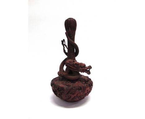 A CHINESE CINNABAR LACQUER VASE  of gourd form, entwined with dragon, 40cm high