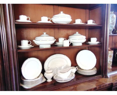 A WEDGWOOD EIGHT SETTING 'CAVENDISH' DINNER SERVICE  comprising eight dinner plates, dessert plates and side plates, three tu