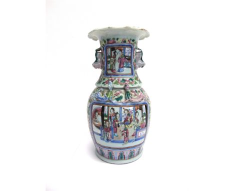 A CHINESE CANTON FAMILLE VERT VASE  the reserves decorated with court scenes on a foliate ground, with relief moulded decorat