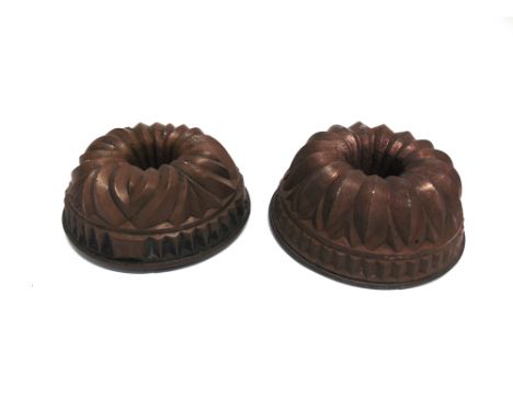 TWO LARGE COPPER JELLY MOULDS  of ring form, 26cm and 27cm diameter