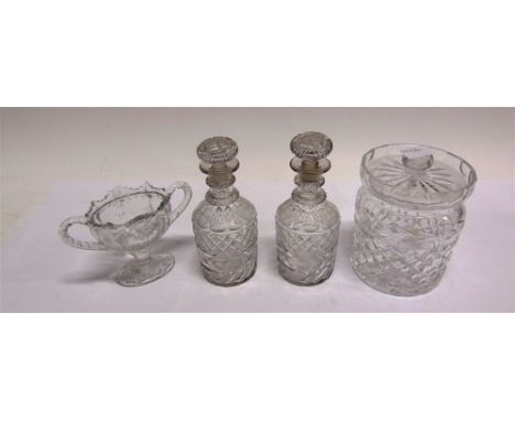 A WATERFORD CRYSTAL BISCUIT BARREL  15cm high; pair of decanters and stoppers, and a press moulded two-handled vase