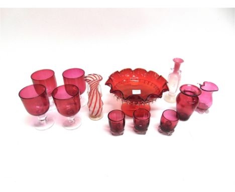 A GROUP OF CRANBERRY AND OTHER GLASSWARE  including four matching glasses, a comporte, and a Venetian glass latticino vase 17