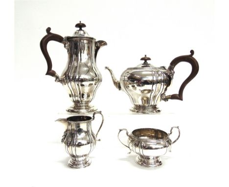 A FOUR PIECE SILVER TEA SERVICE  by A.K. Poston & Co Limited, Birmingham 1936, of segmented baluster form, monogrammed, 1667g