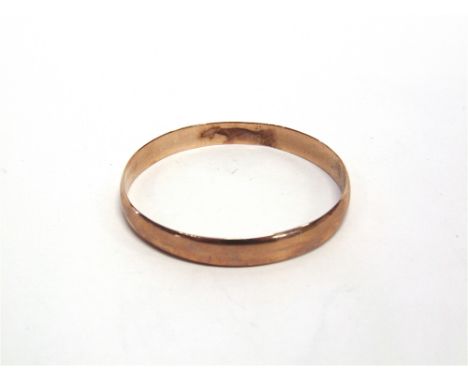 A ROSE GOLD BANGLE stamped '9ct', of solid D section, inscribed, internal diameter 5.2cm, 16g gross