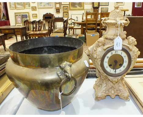 A ceramic decorated striking mantel clock, (no bezel), 38cm high and a brass jardinière, 24cm high, (2).