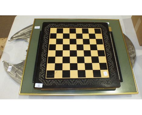 A modern metal-framed oval mirror, the top in the shape of a dragon, 92 x 58.5cm overall, (a/f), a chess board, a Mapa Mundi 