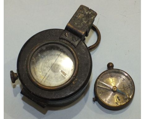 A prismatic compass marked 'T G Co. Ltd, London, no.B60017 1940 Mk III' and a small metal compass, both a/f, (2).