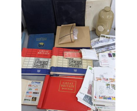 A mixed lot of stamps and first day covers mounted in albums and loose, together with a bed warmerLocation:If there is no con