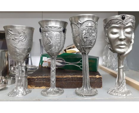 A set of four 1996 Royal Selangor pewter Lord of the Rings goblets, a pair of silver collared decanters and a Concorde hip fl