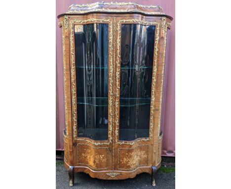 A 19th century French Louis XV style kingwood vitrine display cabinet, serpentine fronted with twin glazed doors with parquet