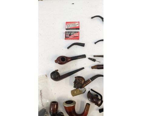 A collection of vintage pipes and smoking related items to include four Falcon examples, a Real Briar a Tyrolian example and 
