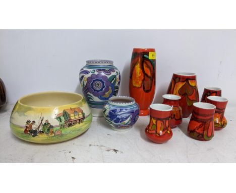 Poole pottery to include Delphis pattern vases, a Mary Brown floral pattern vase and a Royal Doulton bowlLocation:If there is
