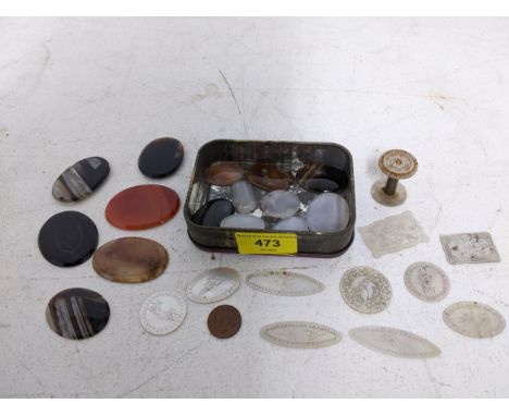 A lot to include Chinese mother of pearl engraved gaming counters, a sewing thread spool, and various polished agate and othe