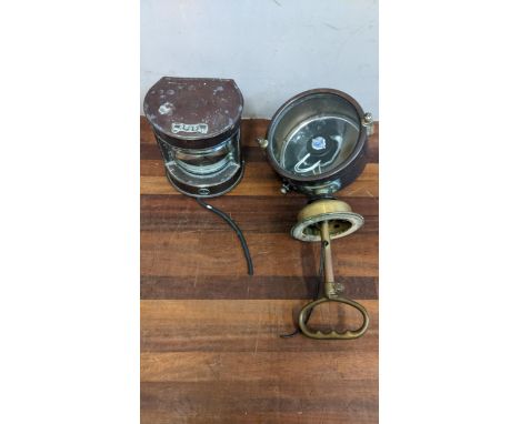 A Francis Searchlights boat lamp in a copper and brass case, and a copper mast light Location:If there is no condition report