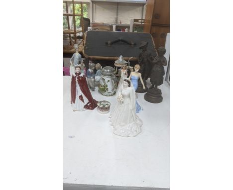 A group of porcelain figures to include Royal Doulton examples, Lladro, Nao and others together with a pair of spelter figure