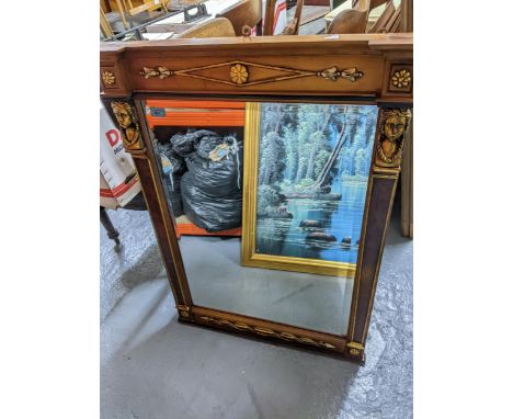 An Italian wooden framed pier mirror with patera and arrow decoration highlighted in gilt, the rectangular bevelled glass pla