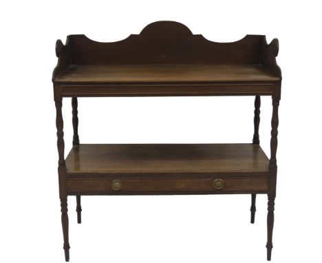 A Regency mahogany washstand, with scroll tray top, turned uprights, lower shelf drawer having brass ring handles and turned 