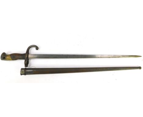 A St Etienne bayonet, engraved and dated 1882, with scabbard, 66cm L.