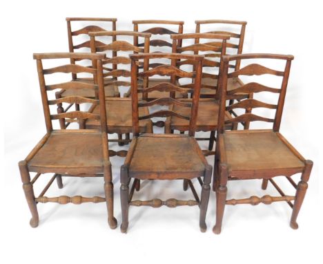 A harlequin set of eight early 19thC ash and elm country chairs, with bow cresting rails, ladder backs, solid seats and turne