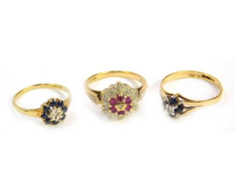 A 9ct gold ruby and diamond flower head ring, size K, a 9ct gold sapphire and diamond flower head ring, size I/J, and a 9ct g