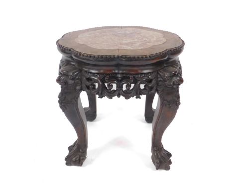 A 19thC Chinese carved hardwood jardiniere stand, with octofoil top inset with rouge marble, having pierced carved wave and s