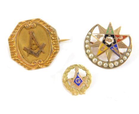 A Masonic crescent and star brooch, decorated in enamel with symbols and set with seed pearls to the crescent, in yellow meta