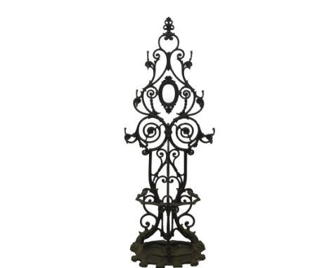 A 19thC cast iron hall stand, cast with S shape rococo scrolling hat and coat hooks and a serpentine stick stand base with in