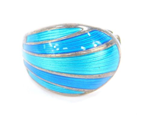 A David Andersen silver and enamel ring, decorated in a fan shaped design, in turquoise and blue guilloche enamel, size M, 7.