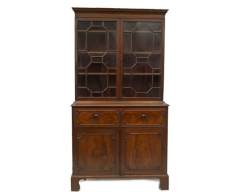 A George III mahogany secretaire bookcase, with dentil moulded cornice over two octagonal astragal glazed doors, with adjusta