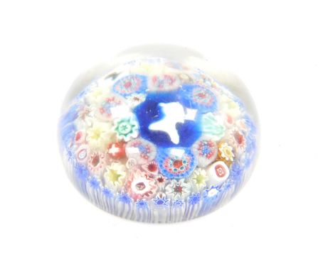 An antique paperweight, in the manner of Baccarat, having two portrait cameo canes and others of millefiori design, 9cm dia.