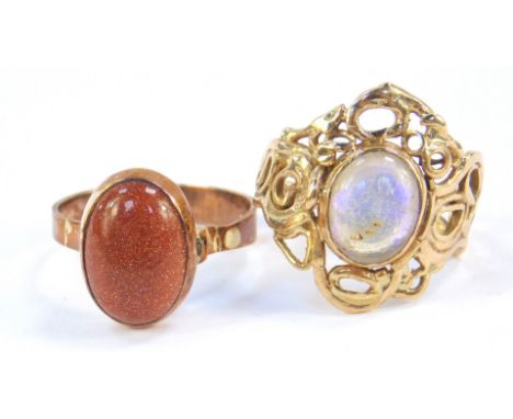 A 9ct gold and moonstone ring, in a fancy scrolling setting, size N, together with a 9ct rose gold and brown gold stone ring,