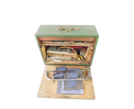 A green painted tool chest, containing chisels, saw and other tools, 37.5cm H, 49.5cm W, 17.5cm D.