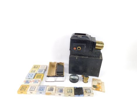 A Victorian magic lantern, together with lantern slides, comprising a handy slide box with slides depicting The Life and Trav