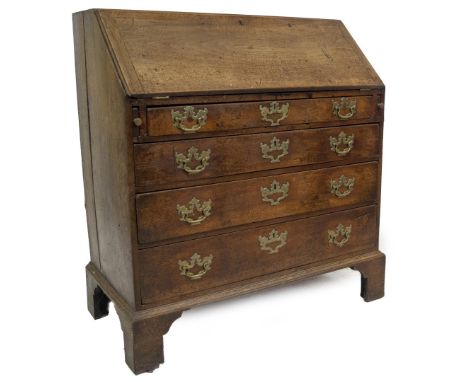 A George III mahogany bureau, with fall flap revealing fitted interior of drawers and pigeon holes, resting on lopers over fo