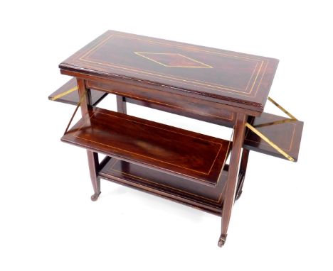 A Victorian rosewood and line inlaid fold over card table, the top over two folding shelves, raised on square tapering suppor